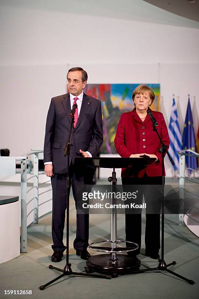 German Chancellor Angela Merkel and Greek Prime Minister Antonis Samaras give statements to the media following a meeting between the two leaders at...