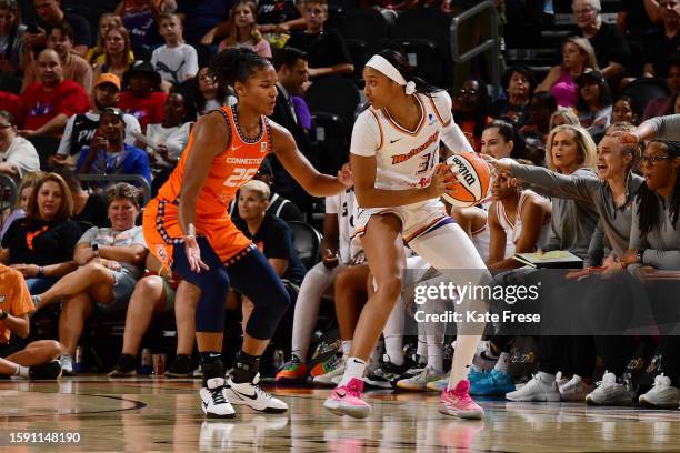 Kadi Sissoko of the Phoenix Mercury looks to pass the ball during the game against the Connecticut Sun on August 10, 2023 at Footprint Center in...