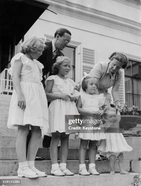 The Dutch royal family pose on the steps of Soestdijk Palace in the Netherlands, on the occasion of Princess Irene's 9th birthday, 5th August 1948....