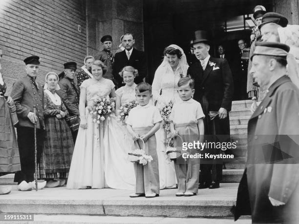 Princess Beatrix, later Queen Beatrix of the Netherlands and her sister Princess Irene act as bridesmaids at the wedding of Lady Cornelie Sickinghe...