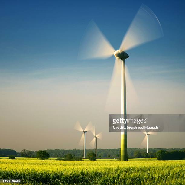 wind turbines - action landscape stock-fotos und bilder
