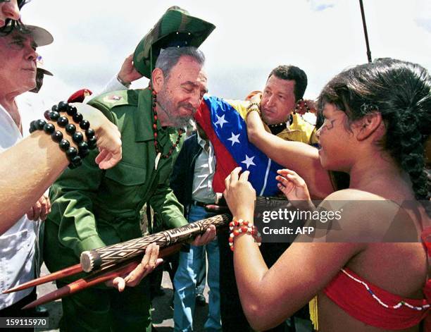 The president of Cuba, Fidel Castro , receives gifts during a visit to the Canaima National Park in the state of Bolivar, about 500 km south-east of...