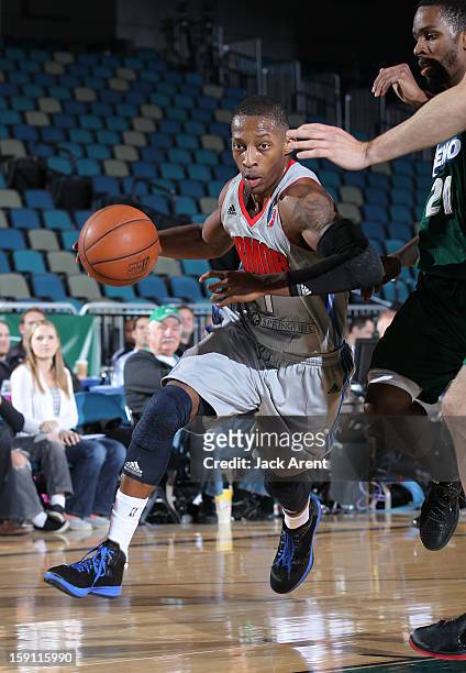Christian Polk of the Springfield Armor dribbles the ball against the Reno Bighorns during the 2013 NBA D-League Showcase on January 7, 2013 at the...