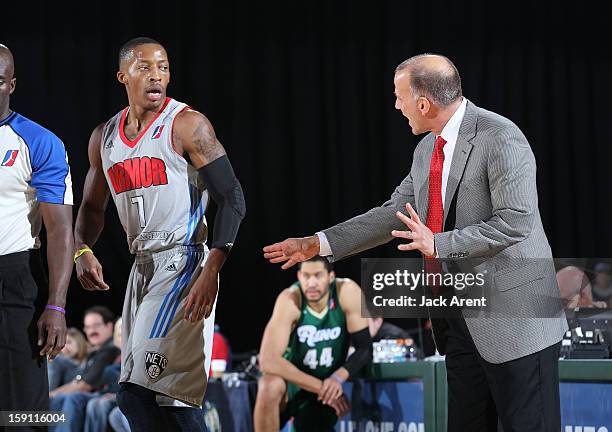 Christian Polk of the Springfield Armor takes direction from head coach Robert MacKinnon while playing against the Reno Bighorns during the 2013 NBA...