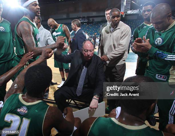 Paul Mokeski head coach of the Reno Bighorns encourages his team during a timeout while playing against the Springfield Armor during the 2013 NBA...