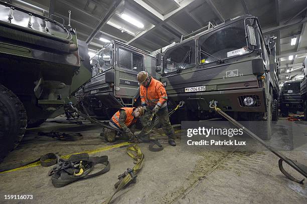 Members of the Bundeswehr, Germany's armed forces, load a Patriot anti-missile system onto a ship for transport to Turkey on January 8, 2013 in...