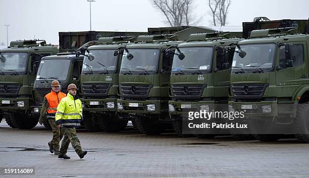 Members of the Bundeswehr, Germany's armed forces, prepare to load a Patriot anti-missile system onto a ship for transport to Turkey on January 8,...