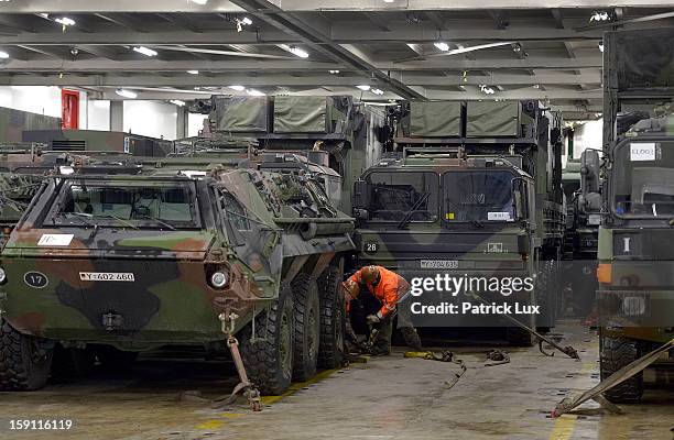 Members of the Bundeswehr, Germany's armed forces, secures a Patriot anti-missile system on a ship for transport to Turkey on January 8, 2013 in...