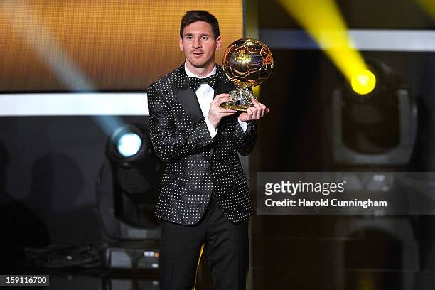Lionel Messi of Argentina holds the trophy after winning the FIFA Ballon d'Or for a fourth consecutive time during the FIFA Ballon d'Or Gala 2013 at...