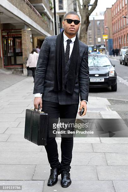 Marketing Exec Thomas poses wearing Ray Ban sunglasses a Taylor and Rye tie, H&M Shirt, Ongara jacket with Burton trousers and shoes and a vintage...