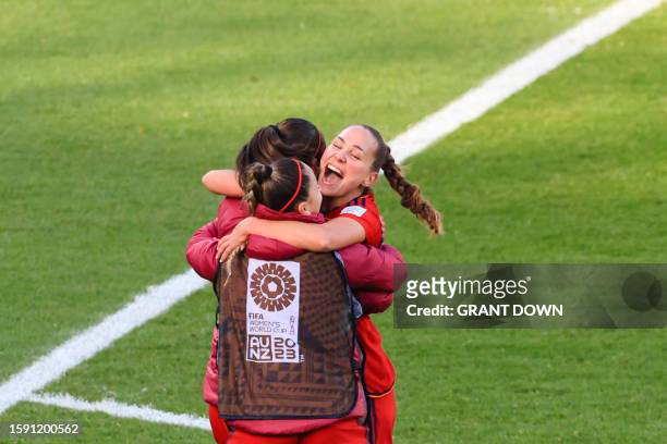 Spain players celebrate their victory after the end of the Australia and New Zealand 2023 Women's World Cup quarter-final football match between...