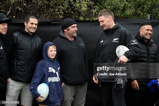 Former All Blacks Richie McCaw and Andrew Hore speak with Jordie Barrett during the New Zealand All Blacks Captain's Run at Otago university Football...