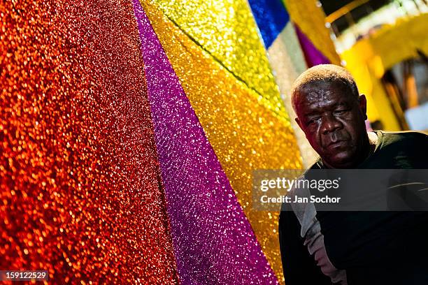 Member of Império Serrano samba school walks along on a carnival float inside the workshop in Rio de Janeiro, Brazil, 13 February 2012. The carnival...