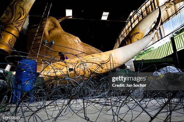 Member of Império Serrano samba school works on a carnival float inside the workshop in Rio de Janeiro, Brazil, 13 February 2012. The carnival...