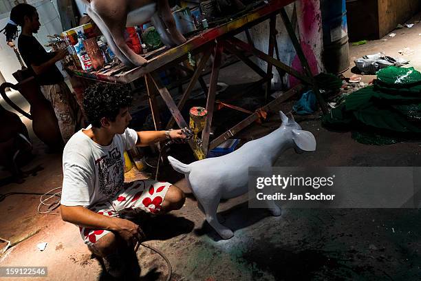 Sculptor of Acadêmicos da Rocinha samba school works on a carnival statue inside workshop in Rio de Janeiro, Brazil, 14 February 2012. The carnival...