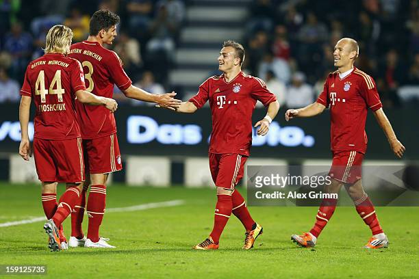 Mario Gomez of Muenchen celebrates his team's fifth goal with team mates Anatoliy Tymoshchuk, Xherdan Shaqiri and Arjen Robben during the friendly...