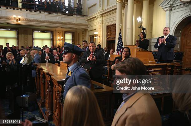 New Jersey Governor Chris Christie , applauds citizen heroes from Hurricane Sandy during his State of the State address in the Assembly Chamber at...