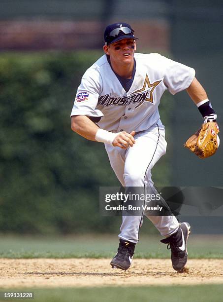 Craig Biggio of the Houston Astros fields during an MLB game versus the Chicago Cubs at Wrigley Field in Chicago, Illinois. Biggio played for the...