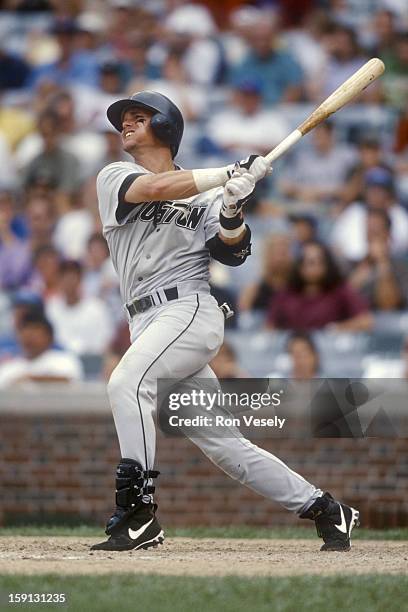 Craig Biggio of the Houston Astros bats during an MLB game versus the Chicago Cubs at Wrigley Field in Chicago, Illinois. Biggio played for the...