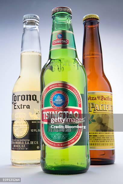 Constellation Brands Inc. Corona Extra, Tsingtao and Pacifico beers are arranged for a photograph in New York, U.S., on Tuesday, Jan. 8, 2013....