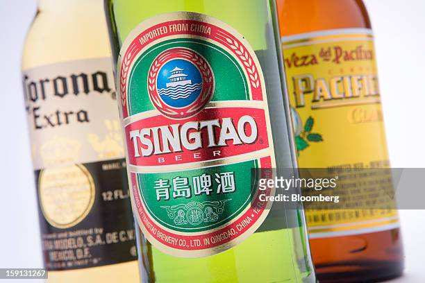 Constellation Brands Inc. Corona Extra, Tsingtao and Pacifico beers are arranged for a photograph in New York, U.S., on Tuesday, Jan. 8, 2013....