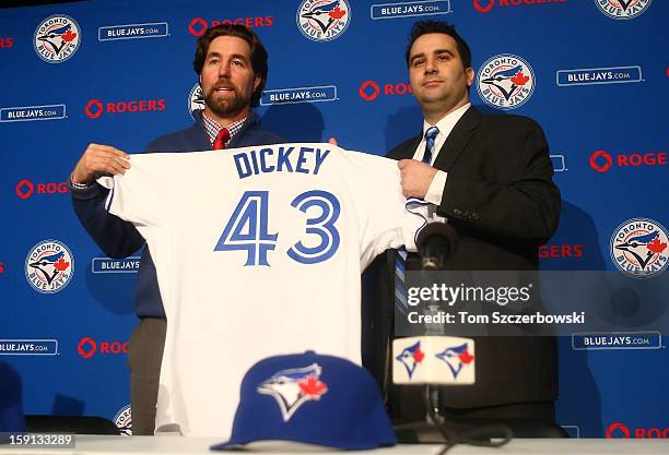 Dickey of the Toronto Blue Jays is introduced at a press conference as he is presented with a jersey from general manager Alex Anthopoulos at Rogers...