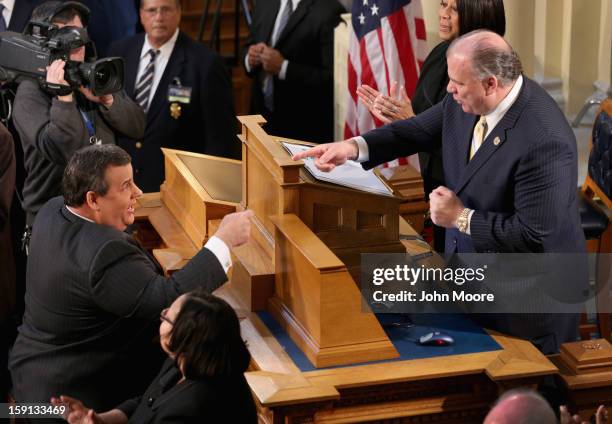 Republican New Jersey Governor Chris Christie , greets New Jersey Senate President Steve Sweeney, a Democrat, before Christie's State of the State...