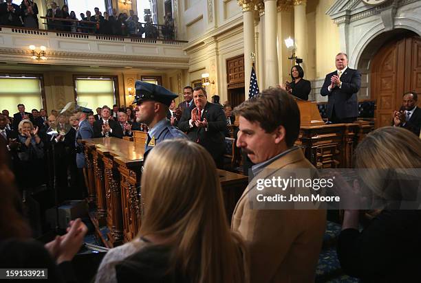 New Jersey Governor Chris Christie , applauds citizen heroes from Hurricane Sandy during his State of the State address on January 8, 2013 in...