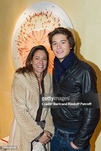 Andrea Lucas and her son Adrien Pauwels attend the 'Sorcieres' exhibition preview at Galerie Pierre Passebon on January 8, 2013 in Paris, France.