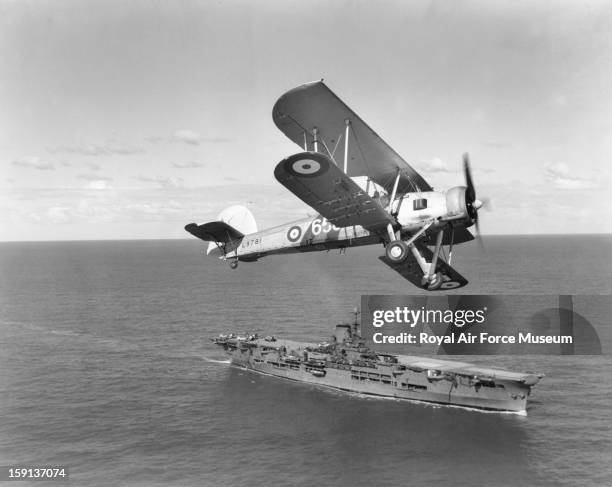 Fairey Swordfish I of 820 Squadron over HMS Ark Royal, 1939.