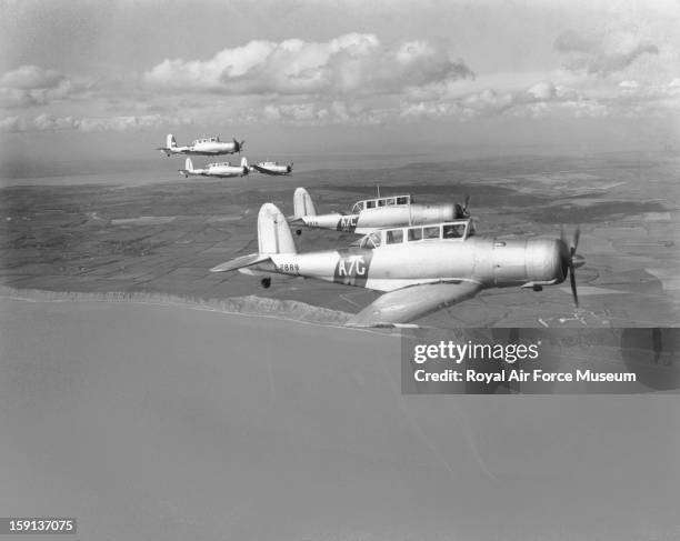 Blackburn Skua Mk. IIs of 803 Squadron, in formation over coast, 1939.