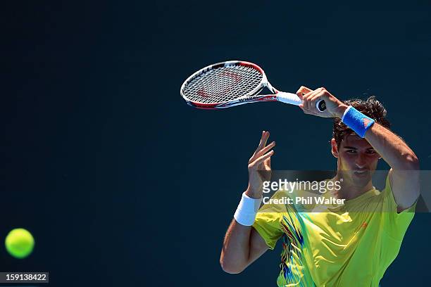 Thomaz Bellucci of Brazil plays a forehand in his second round match against Lukas Lacko of Slovakia during day three of the Heineken Open at the ASB...