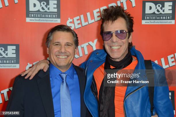 Director and Celebrity Photographer Kevin Mazur and musician Slim Jim Phantom arrive at the premiere of "$ellebrity" at Mann's 6 Theatre on January...