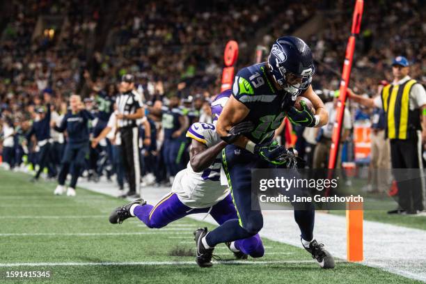 Jake Bobo of the Seattle Seahawks scores a touchdown during the second half of the preseason game against the Minnesota Vikings at Lumen Field on...
