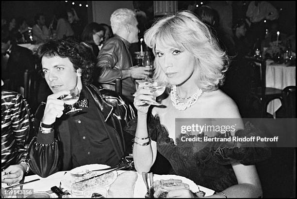 Amanda Lear and her friend Alain-Philippe Malagnac attend a "Femme Fatale" theme party at the "Palace" night club in Paris in 1980.