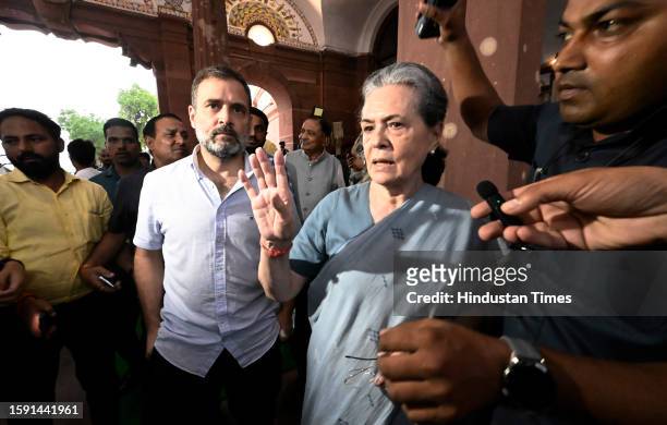 Congress MPs Sonia Gandhi and Rahul Gandhi leave Parliament premises after Opposition MPs stage a walkout from the Lok Sabha during Prime Minister...