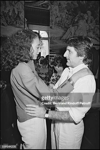Fashion designer Emanuel Ungaro and Marisa Berenson attend a fashion in Paris in 1981.