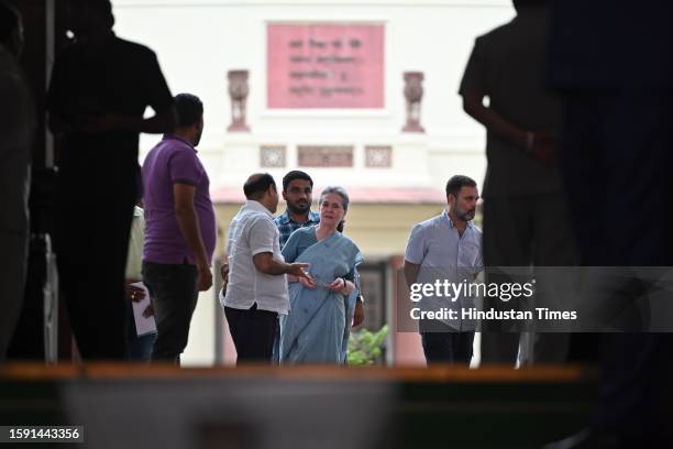 Congress MPs Sonia Gandhi and Rahul Gandhi leave Parliament premises after Opposition MPs stage a walkout from the Lok Sabha during Prime Minister...