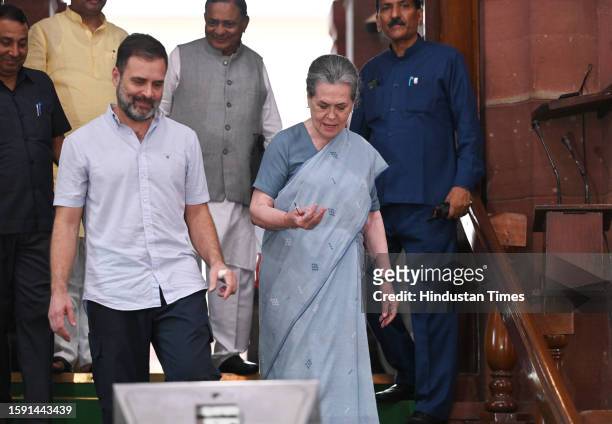 Congress MPs Sonia Gandhi and Rahul Gandhi leave Parliament premises after Opposition MPs stage a walkout from the Lok Sabha during Prime Minister...