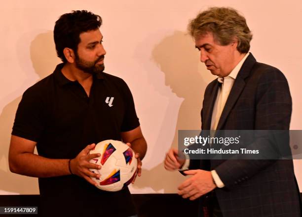 Indian cricket team captain and LALIGA ambassador Rohit Sharma along with Cachaza, MD, Laliga, speaks during announcement of new brand identity and...