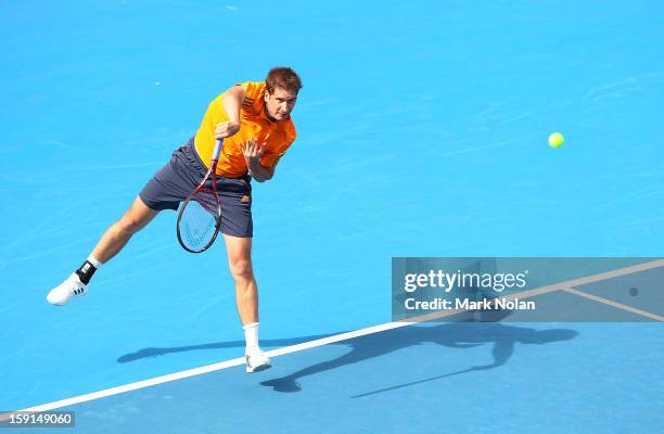 Florian Meyer of Germany serves in his second round match against Bernard Tomic of Australia during day four of the Sydney International at Sydney...