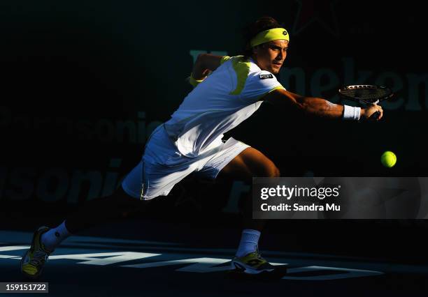 David Ferrer of Spain plays a backhand in his second round match against Yen-Hsun Lu of Taipei during day three of the Heineken Open at ASB Tennis...