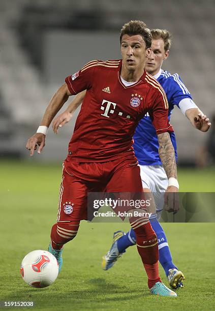 Mario Mandzukic of Bayern Munich in action during the friendly game between FC Bayern Munich and FC Schalke 04 at the Al-Sadd Sports Club Stadium on...