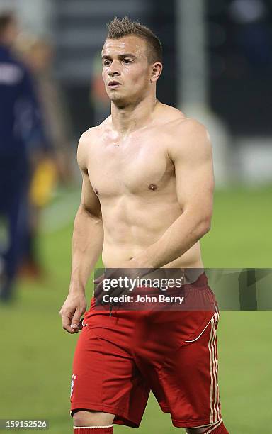 Xherdan Shaqiri of Bayern Munich leaves the field bare chest after the friendly game between FC Bayern Munich and FC Schalke 04 at the Al-Sadd Sports...