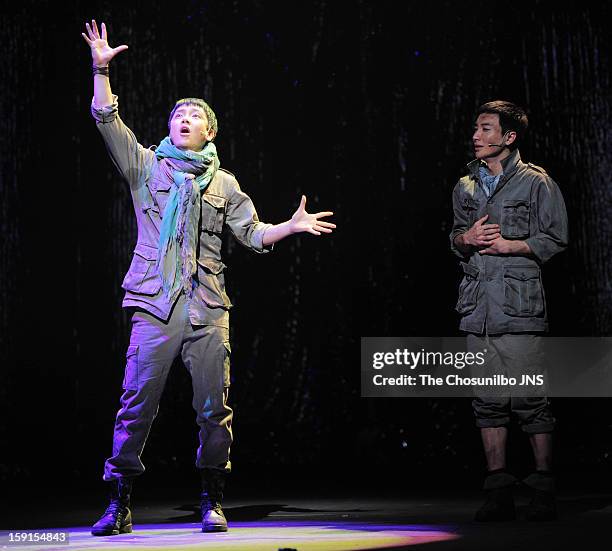 Yoon-Hak of Supernova and Lee-Teuk of Super Junior perform during the musical 'The Promise' press call at the National Theater of Korea Main Hall...