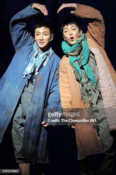 Lee-Teuk of Super Junior and Yoon-Hak of Supernova perform during the musical 'The Promise' press call at the National Theater of Korea Main Hall...