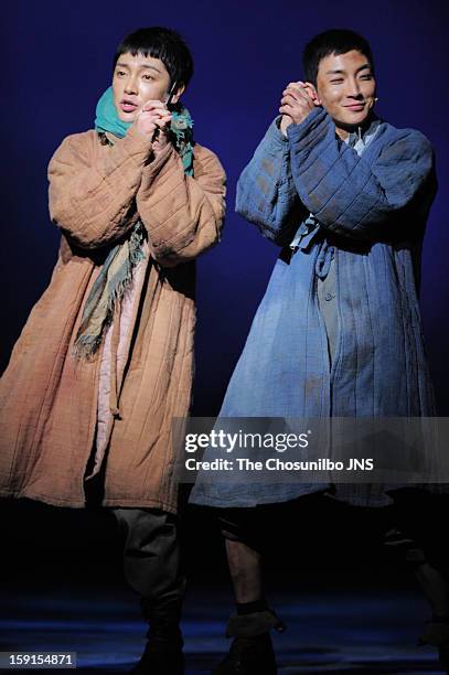 Yoon-Hak of Supernova and Lee-Teuk of Super Junior perform during the musical 'The Promise' press call at the National Theater of Korea Main Hall...