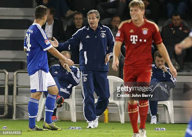 Jens Keller, coach of Schalke 04 gives his instructions during the friendly game between FC Bayern Munich and FC Schalke 04 at the Al-Sadd Sports...