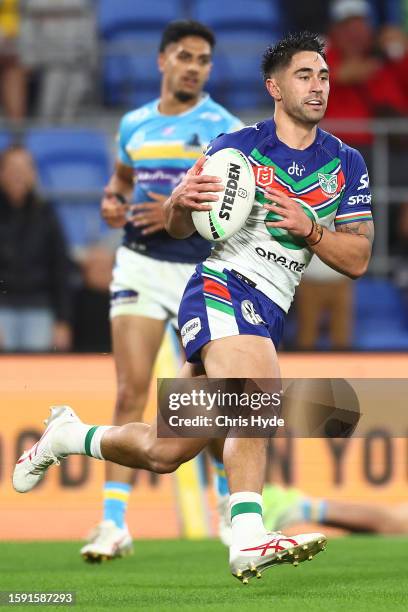 Shaun Johnson of the Warriors scores a try during the round 23 NRL match between Gold Coast Titans and New Zealand Warriors at Cbus Super Stadium on...