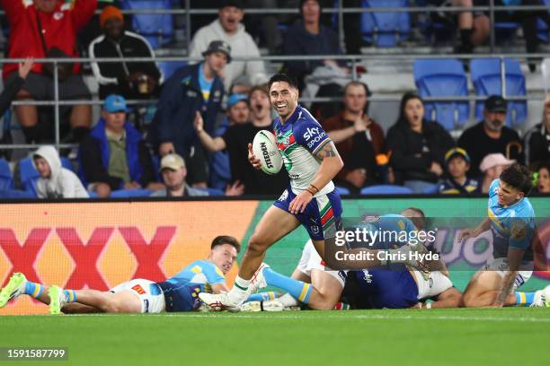 Shaun Johnson of the Warriors scores a try during the round 23 NRL match between Gold Coast Titans and New Zealand Warriors at Cbus Super Stadium on...